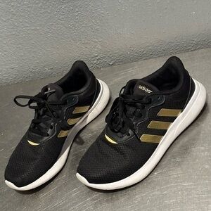Women’s cloud foam black and gold sneakers